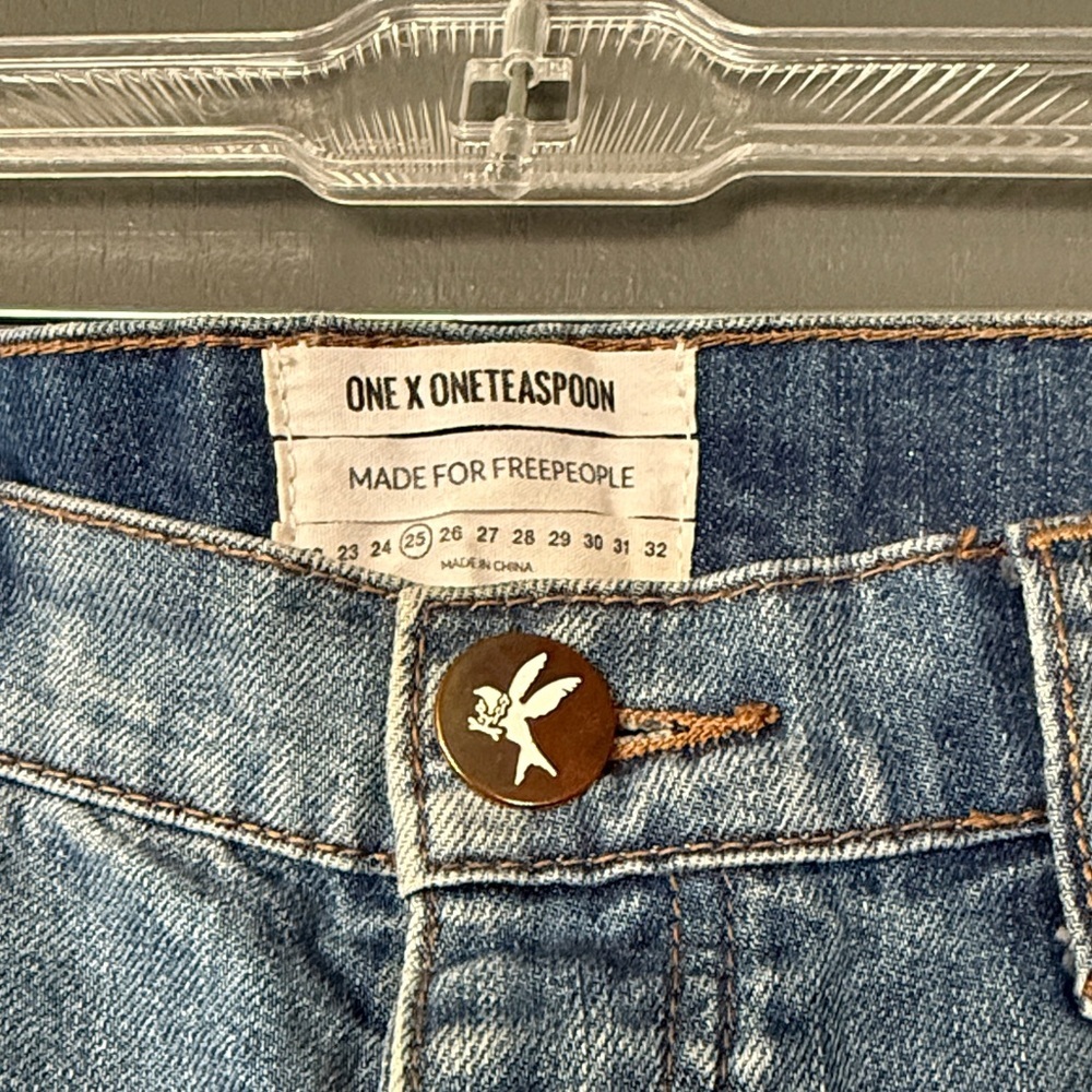 Free People Distressed Blue Jeans with cuffed ankles. Low waist medium rise - Picture 2 of 4